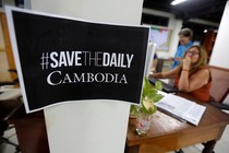 A sign says "Save The Daily Cambodia" in the newspaper's newsroom in September 2017