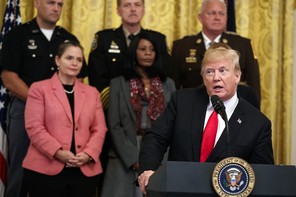 Trump addresses a crowd from a podium