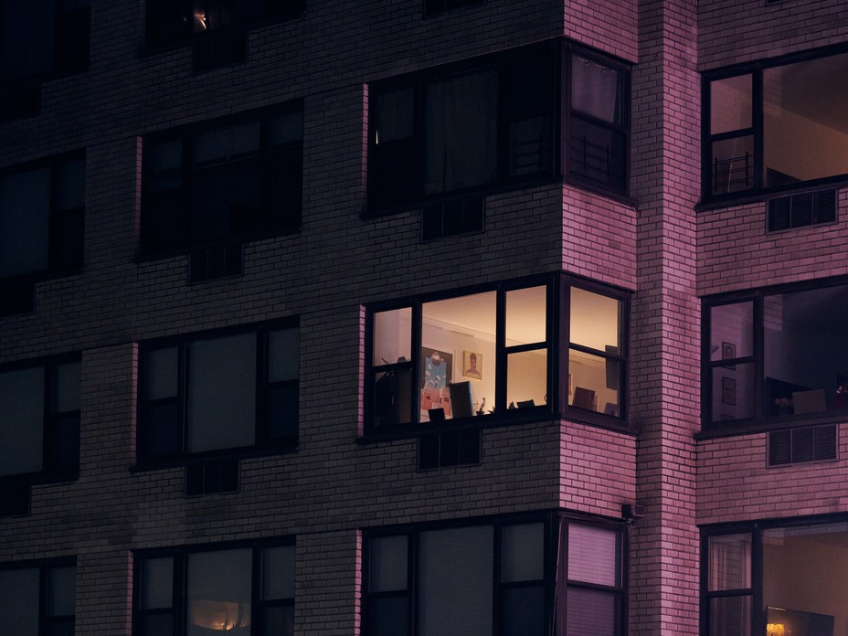 a building with an apartment lit up at night
