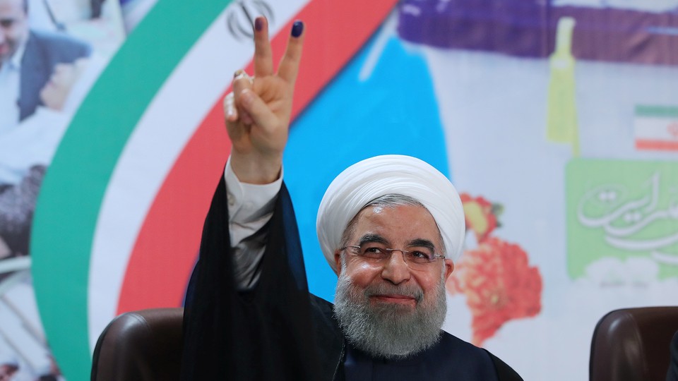 Iran's President Hassan Rouhani gestures as he registers to run for a second four-year term in the May election, in Tehran, Iran, on April 14, 2017.