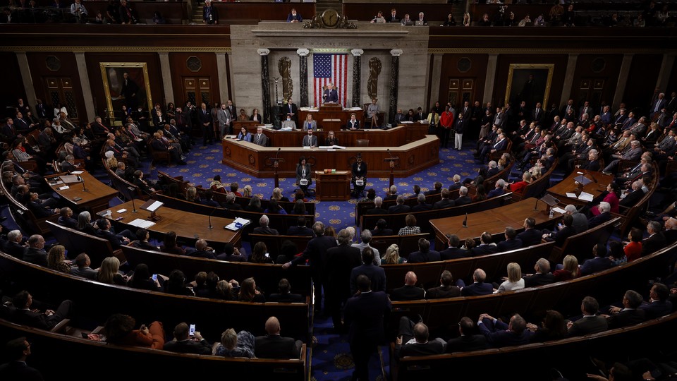 Representatives are seated for a vote in the House Chambers