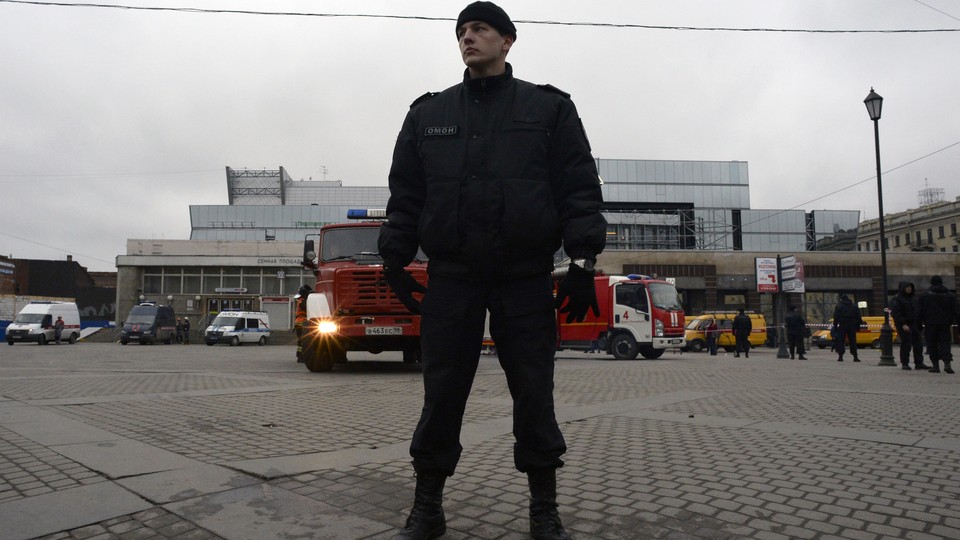 A riot police officer guards the area next to the entrance to Sennaya Square metro station in Saint Petersburg on April 3, 2017.