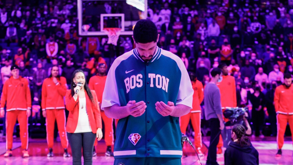 Enes Kanter Freedom of the Boston Celtics during the American national anthem prior to the first half of their NBA game against the Toronto Raptors at Scotiabank Arena, in Toronto, Canada, on November 28, 2021