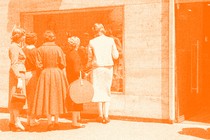 A vintage photo of women window shopping at a store