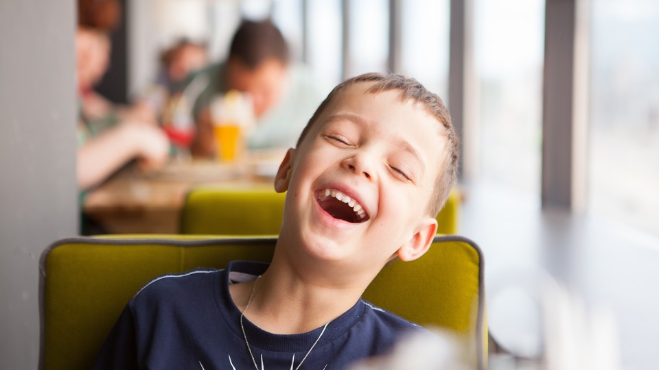 A kid laughing