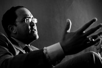 Will Hurd gesticulates in a black-and-white photo.