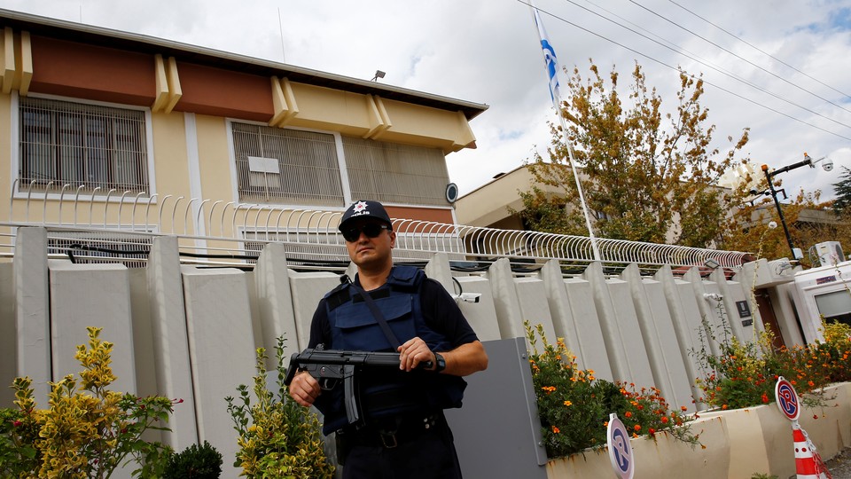 A police officer stands guard in front of the Israeli Embassy in Ankara, Turkey, September 21, 2016.