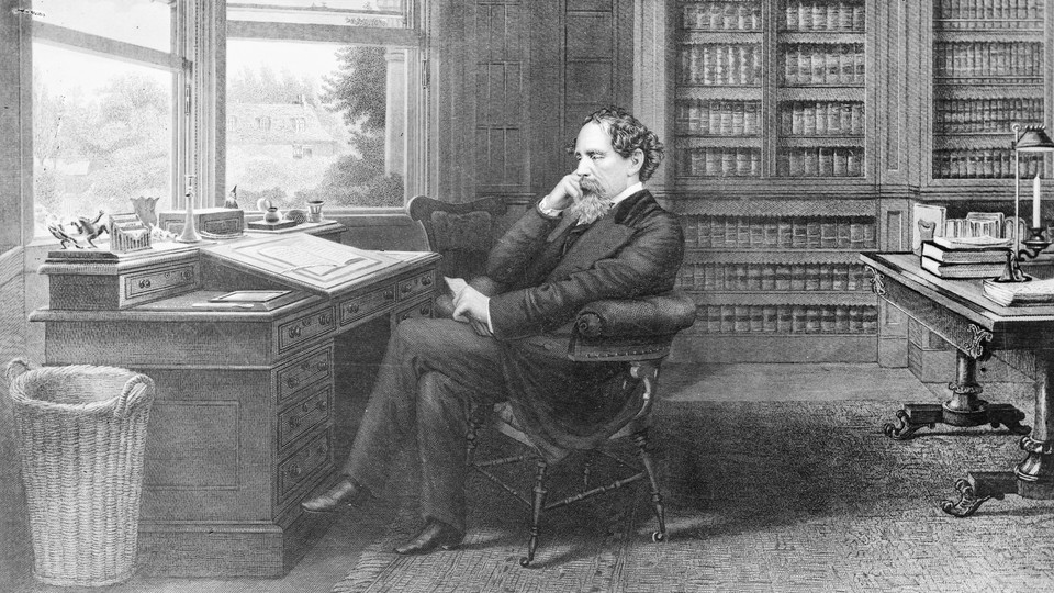 Charles Dickens in his home study