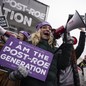 Protesters at the March for Life holding "I am the post-Roe generation" signs.