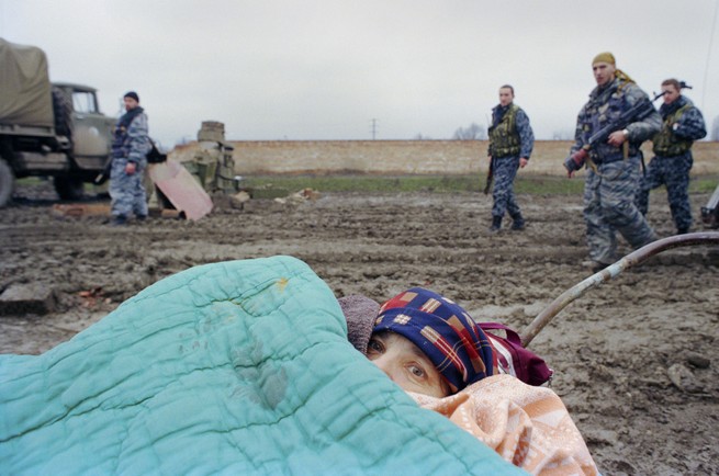 Troops guarding a fortified place crossword clue