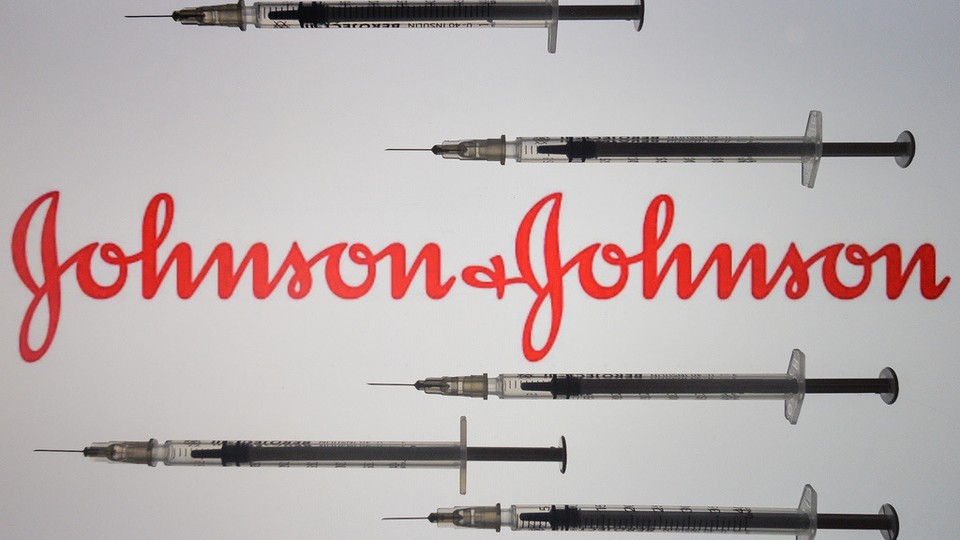 Vaccine needles surrounding the Johnson & Johnson logo