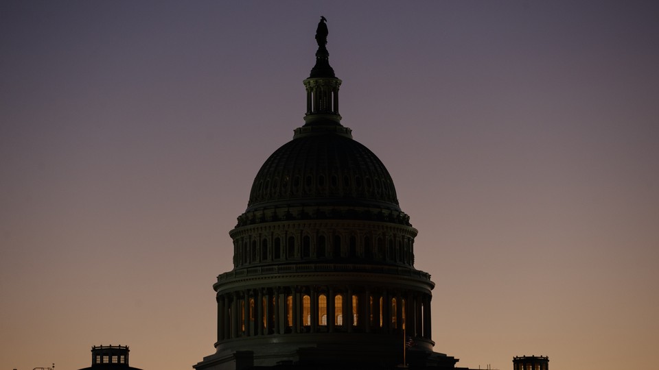 The U.S. Capitol Building dome is seen before the sun rises in Washington, D.C.