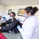 An in-home nurse cares for a woman while she recovers from COVID-19 at her home in Baltimore, Maryland.