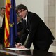 Catalan President Carles Puigdemont signs the Catalan declaration of independence.