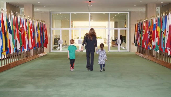 Samantha Power walks with her two children in the UN