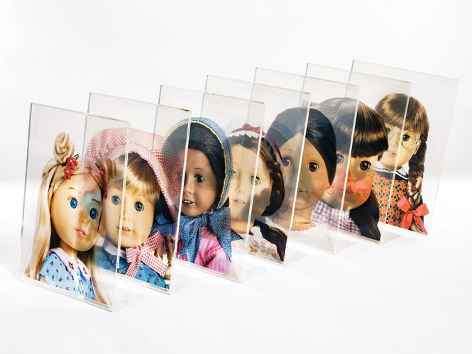 photos of 7 clear acrylic photo frames in a diagonal row, each with a translucent doll photo so that one overlaps the next