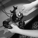 A woman's hand dials an antique phone.
