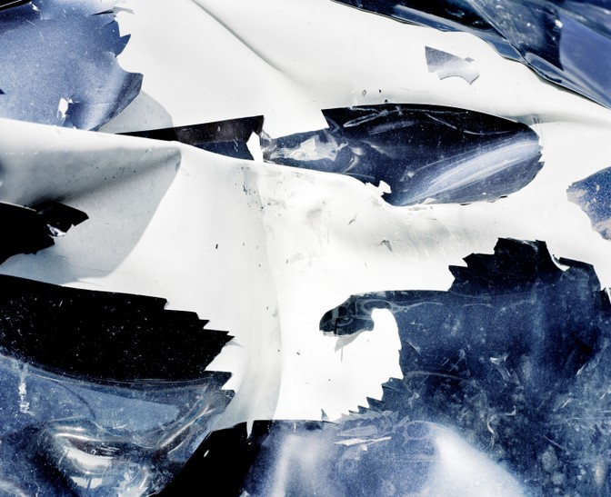 detail of exterior of wrecked blue car