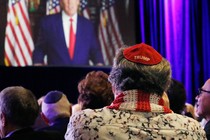 A Jewish Trump supporter is seen from behind sitting in a crowd