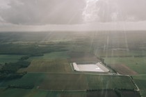 The Mauzè-sur-le-Mignon reservoir — a silver rectangle among fields of green