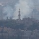 Smoke rises over the Syrian town of Ras al-Ain.