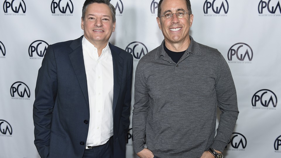 Netflix's chief content officer Ted Sarandos stands next to the comedian Jerry Seinfeld.