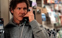 Harrison Ford on a payphone in a scene from the film 'The Fugitive'