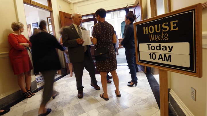State legislators meet at Maine's statehouse.