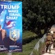 Military personnel patrol next to a sign welcoming the move of the U.S. embassy to Jerusalem.