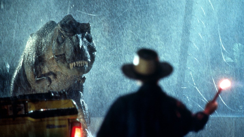 A still of a T-Rex hunting people down in Jurassic Park