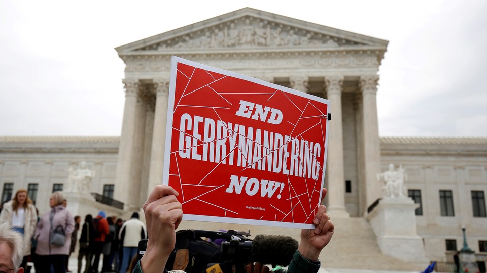 Demonstrators protest gerrymandering in front of the Supreme Court