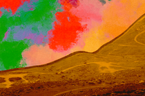 Photo-illustration of a desert hill with a sky full of red, green and yellow patches.