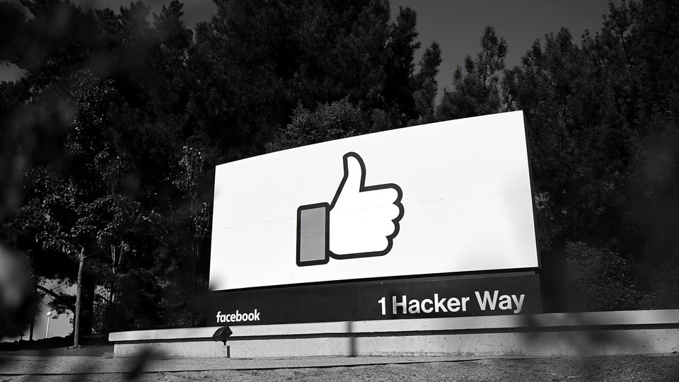 A Facebook sign reading 1 Hacker Way