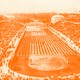An image of the stadium in Athens filled with people (with an orange tint)