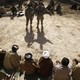 Interpreters being addressed by two soldiers in Afghanistan