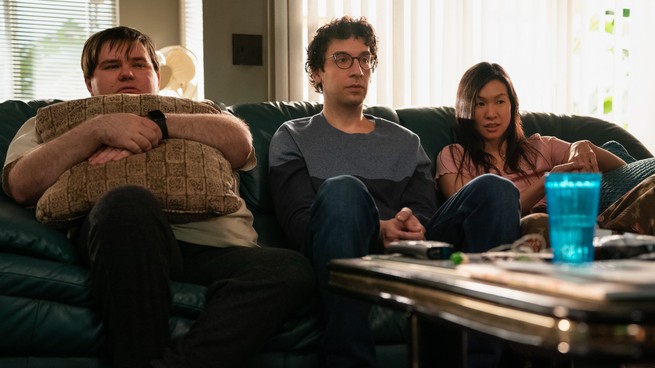 Three people sitting on a couch with perplexed expressions, in "As We See It"