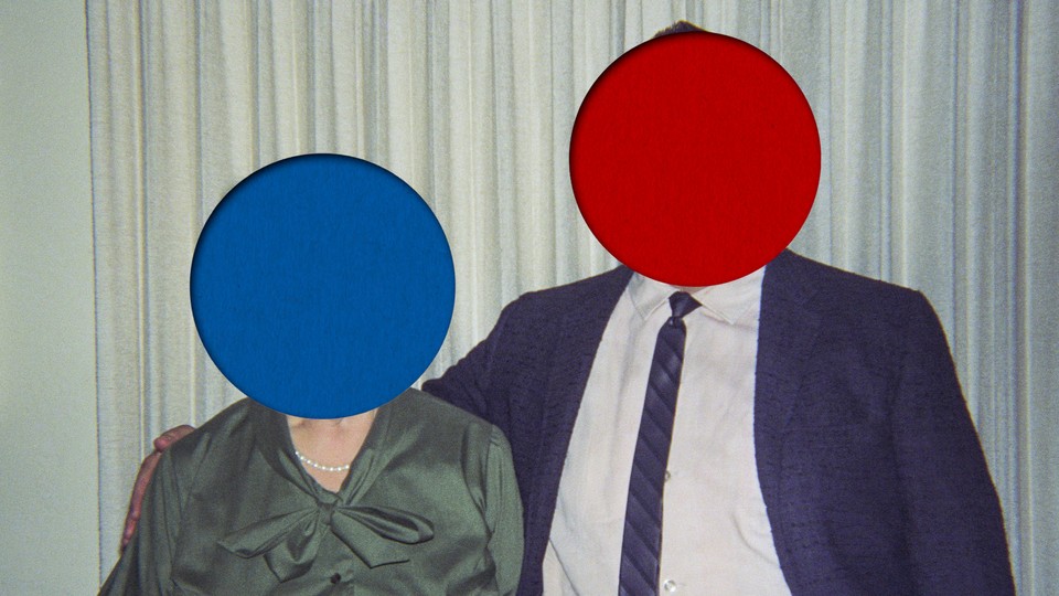 Image of a couple, with a blue dot on the woman's face and a red dot on the man's face