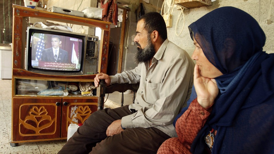 Palestinians in Khan Younis watch Barack Obama speak in Cairo on June 4, 2009.