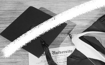 A photo-illustration featuring a graduation cap, gown, and diploma. A white line crosses through the middle