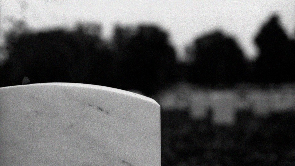 A military headstone in a cemetery
