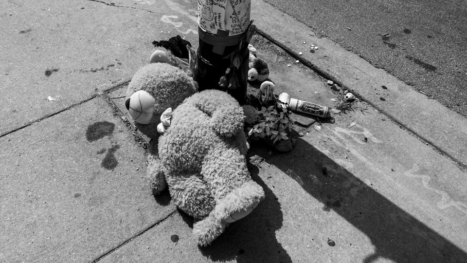 A teddy bear lies at a memorial for a shooting victim in Chicago.