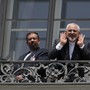 Iranian Foreign Minister Mohammad Javad Zarif (R) talks to journalist from a balcony of the Palais Coburg hotel where the Iran nuclear talks were being held in Vienna, Austria July 10, 2015.