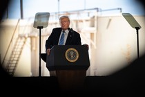 Donald Trump speaking in front of an oil rig