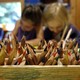 Two children draw with colored pencils 