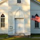 White church with an American flag