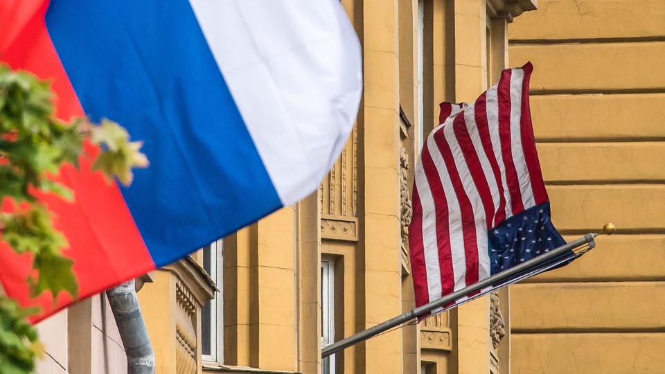 A Russian flag flies next to the U.S. embassy in Moscow on July 31, 2017.
