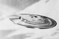 Black-and-white illustration of a flying saucer