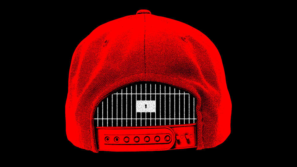 A red baseball cap with a jail cell in the space at its rear