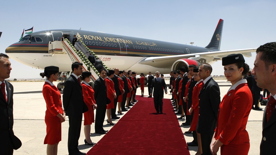 Flight attendants participate in a special ceremony after new aircrafts are acquired by Royal Jordanian.