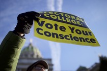 A protestor outside of the Pennsylvania Capitol Building in December 2016.